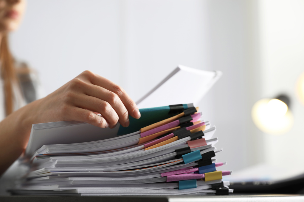 Female Paperwork Pile