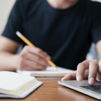 Man Writing Laptop